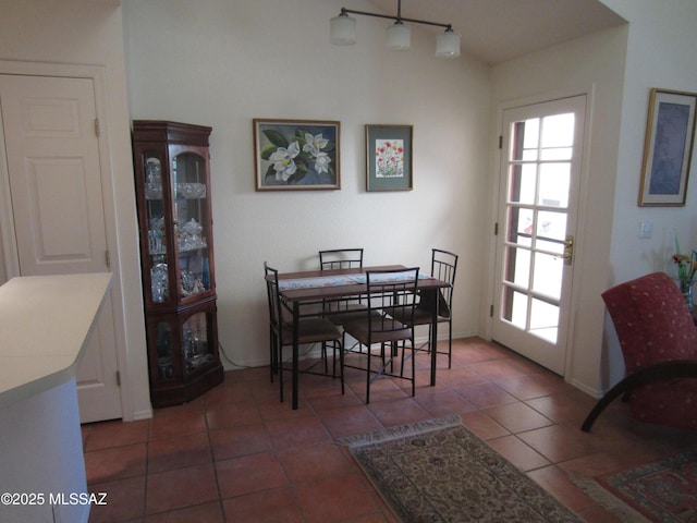 tiled dining area featuring plenty of natural light