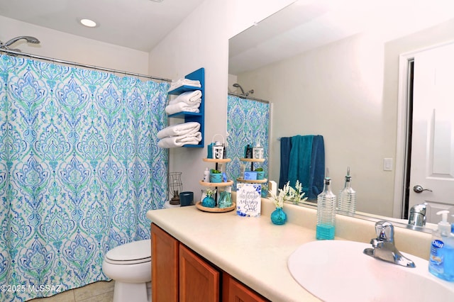 bathroom featuring toilet, a shower with curtain, tile patterned flooring, and vanity