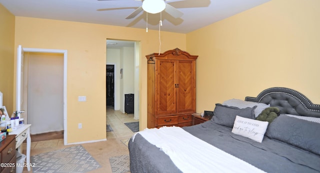 bedroom featuring a ceiling fan and baseboards