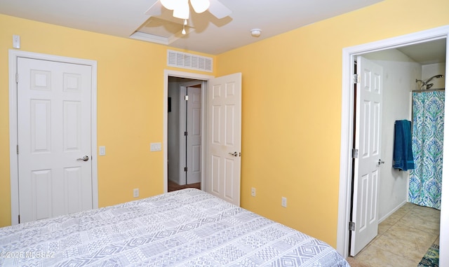 bedroom with ceiling fan, visible vents, and tile patterned floors