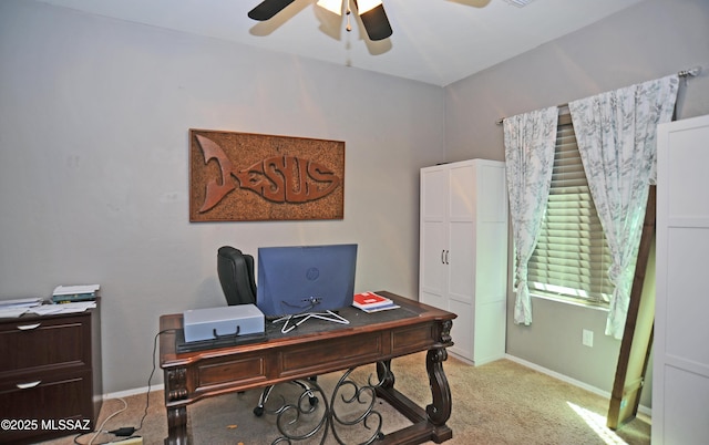 office area with ceiling fan, baseboards, and light colored carpet