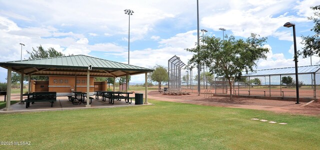 surrounding community with a yard, a gazebo, and fence