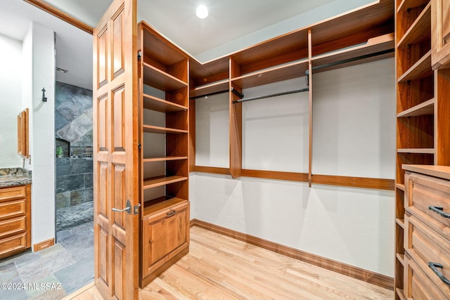 spacious closet with light wood finished floors