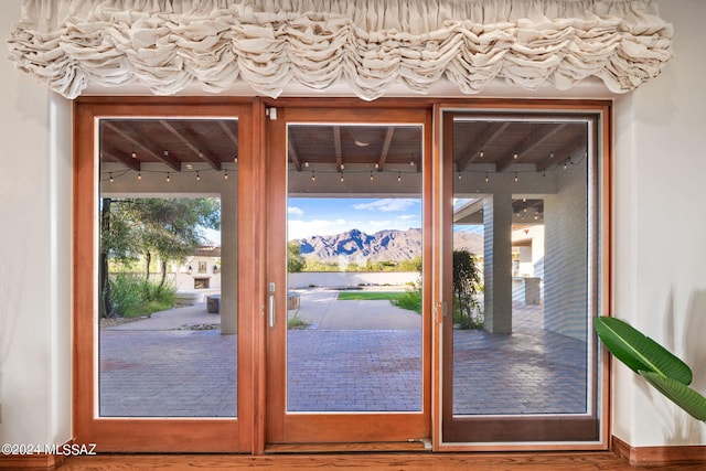 doorway with wood finished floors