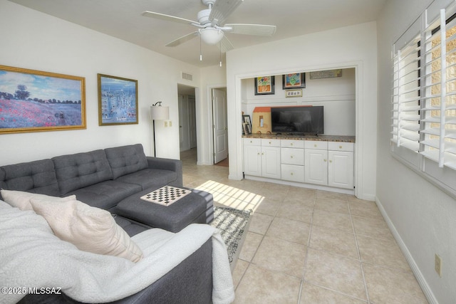 10931 E Via Tranquilla, Tucson, AZ 85749 - living area with light tile patterned flooring and ceiling fan