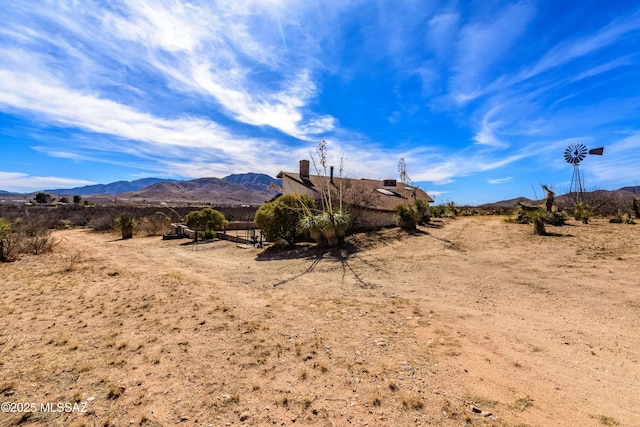 mountain view featuring a rural view