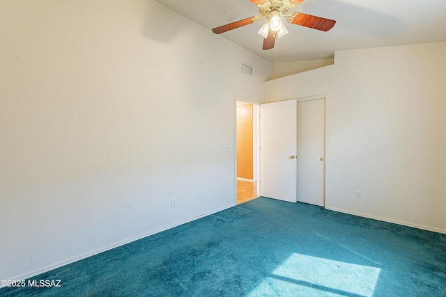 unfurnished bedroom with carpet, visible vents, vaulted ceiling, ceiling fan, and baseboards