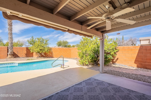 view of pool with a patio, a fenced backyard, a ceiling fan, and a fenced in pool