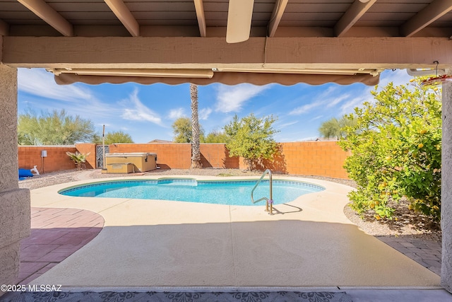 view of swimming pool with a patio, a fenced backyard, a fenced in pool, and a hot tub