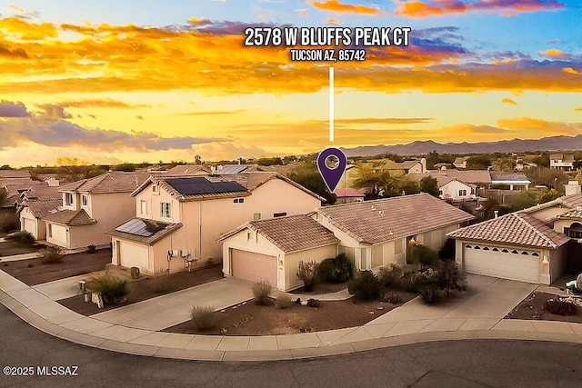 aerial view at dusk with a residential view