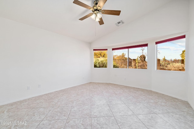 unfurnished room with visible vents, vaulted ceiling, a ceiling fan, and light tile patterned flooring
