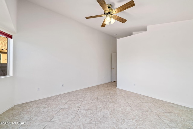 unfurnished room with ceiling fan and light tile patterned flooring