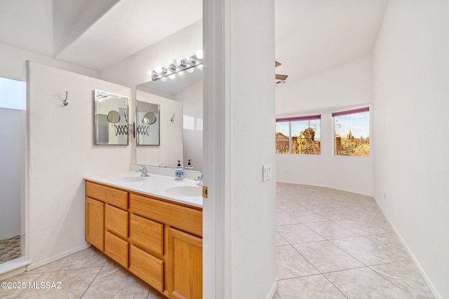 bathroom with double vanity, tile patterned flooring, and a sink