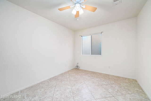 unfurnished room featuring light tile patterned floors, baseboards, visible vents, and a ceiling fan