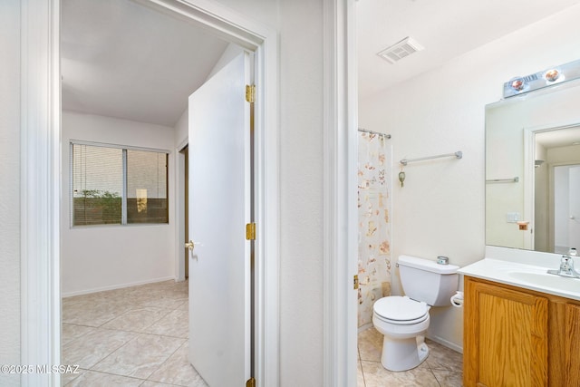 bathroom featuring tile patterned flooring, visible vents, vanity, and toilet