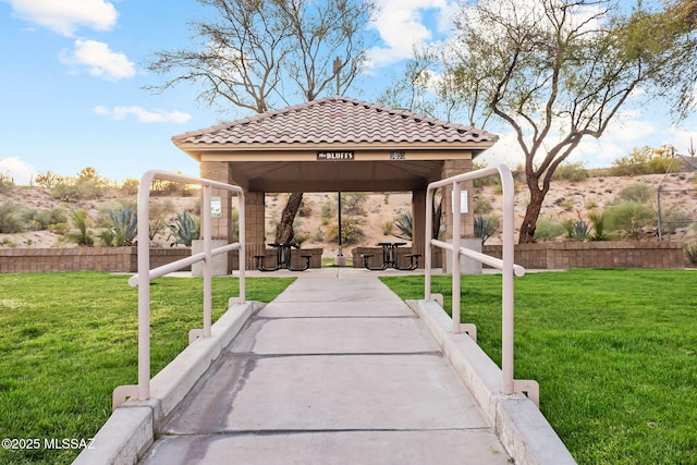 view of patio with fence and a gazebo