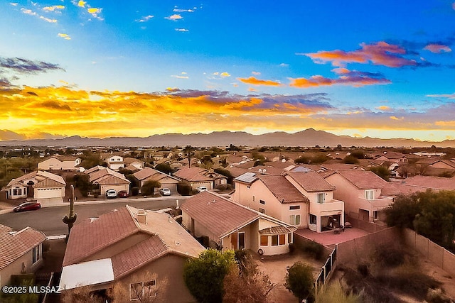 drone / aerial view featuring a residential view and a mountain view