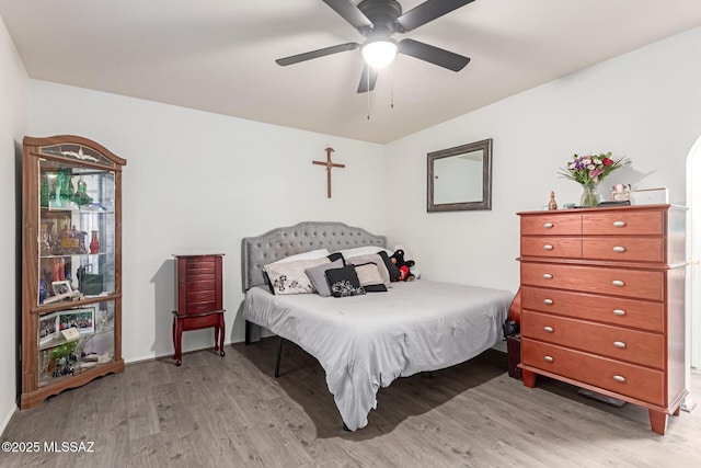 bedroom with light wood-type flooring and ceiling fan