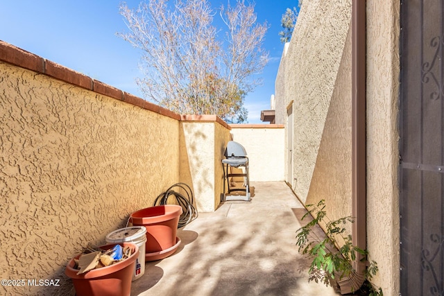 view of patio / terrace featuring a grill and a fenced backyard