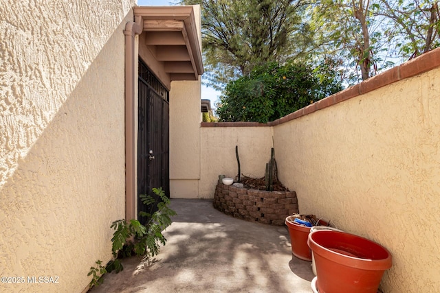 view of patio featuring fence