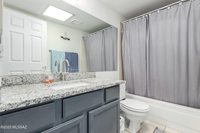 full bathroom featuring toilet, tile patterned floors, shower / tub combo with curtain, and vanity