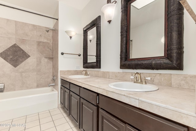 bathroom with tile patterned flooring, tub / shower combination, a sink, and double vanity