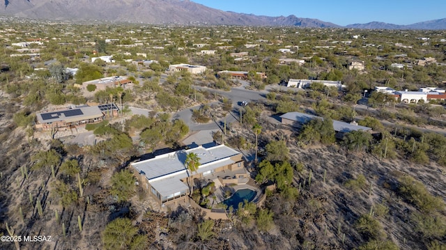 birds eye view of property featuring a mountain view