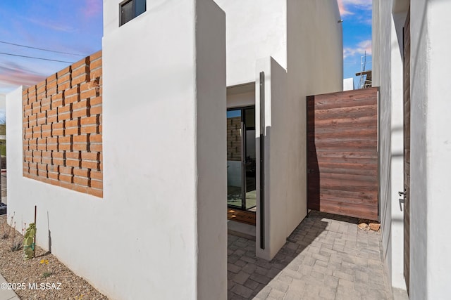 view of side of property with stucco siding