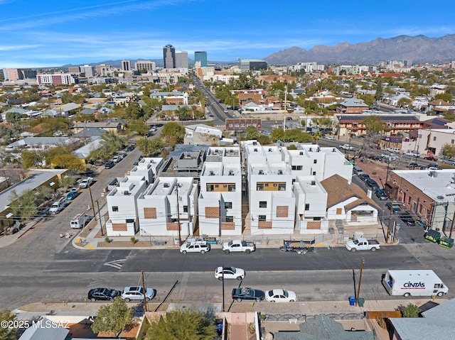 birds eye view of property featuring a mountain view