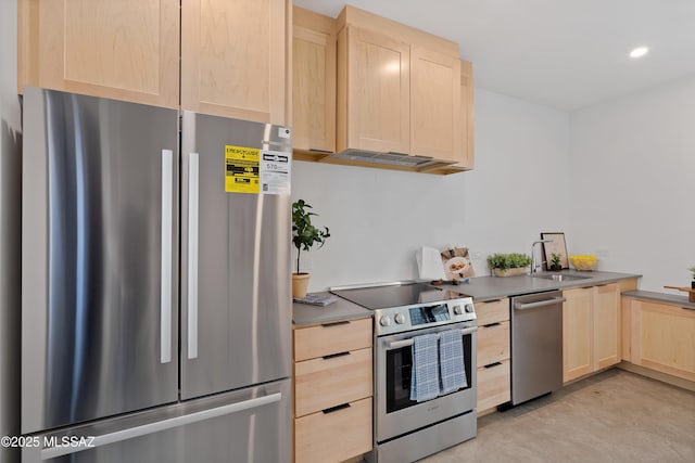 kitchen featuring light brown cabinets, appliances with stainless steel finishes, concrete floors, a sink, and recessed lighting