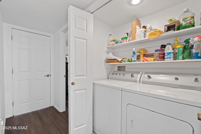 laundry area featuring laundry area, separate washer and dryer, and dark wood-style flooring