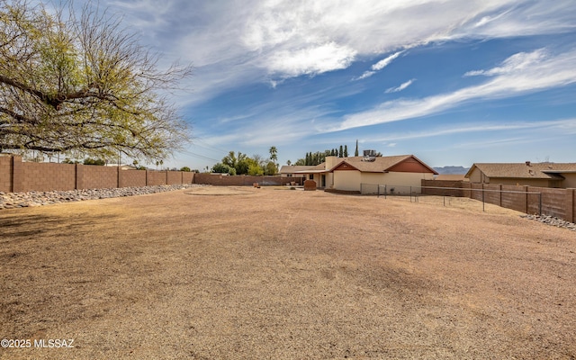 view of yard featuring a fenced backyard