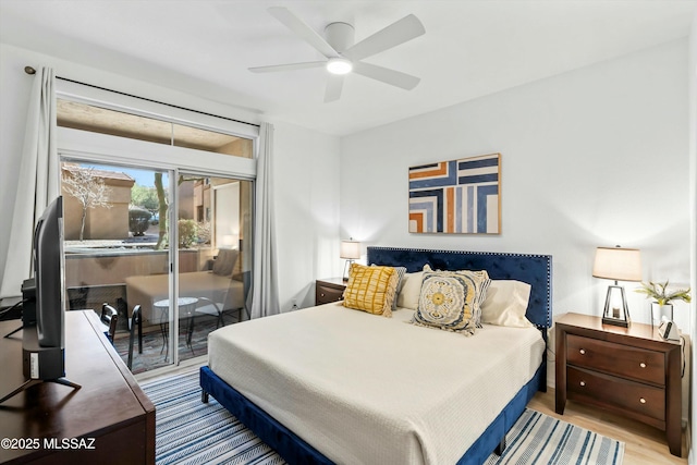 bedroom with access to exterior, a ceiling fan, and wood finished floors