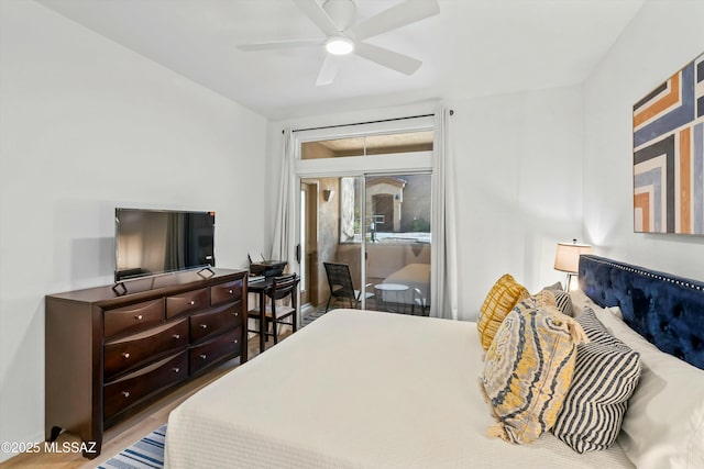 bedroom featuring access to exterior, ceiling fan, and wood finished floors