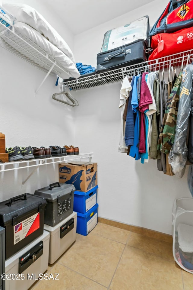 spacious closet with tile patterned flooring