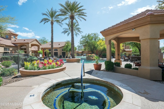 view of pool featuring fence and a patio