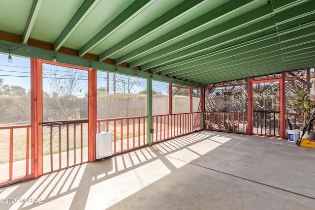 unfurnished sunroom with a wealth of natural light