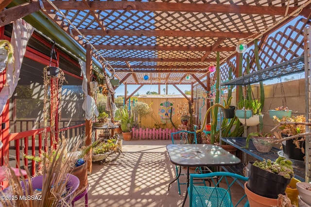 view of patio / terrace with fence and a pergola