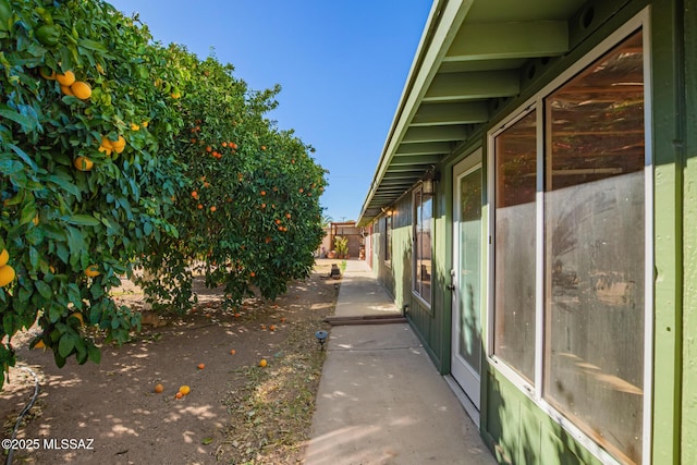 view of side of home with fence