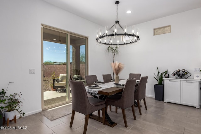 dining room featuring recessed lighting and baseboards