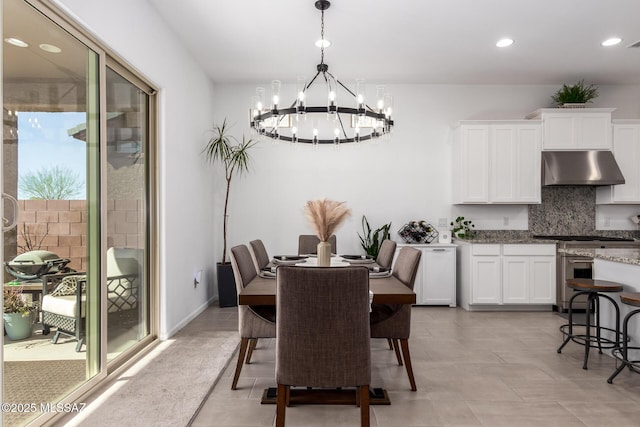 dining area featuring a chandelier and recessed lighting