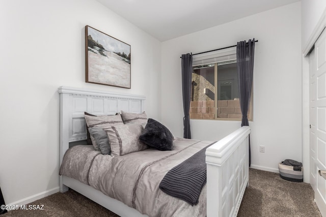 bedroom featuring carpet floors and baseboards