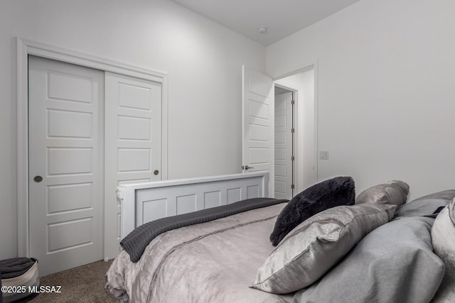 bedroom with a closet and carpet flooring