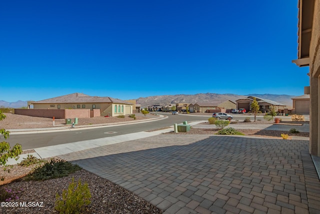 exterior space with a residential view and a mountain view