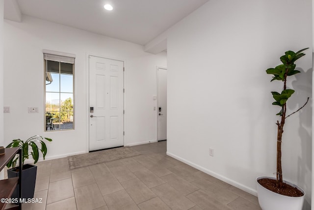 foyer featuring recessed lighting and baseboards