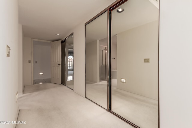 corridor featuring recessed lighting and light colored carpet