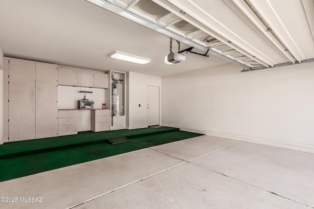 garage featuring water heater and a garage door opener