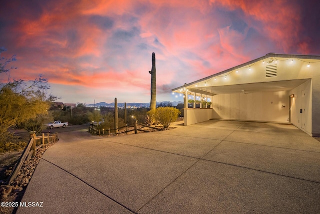 exterior space featuring concrete driveway