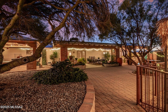 view of patio terrace at dusk