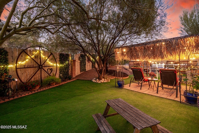 view of yard featuring a patio area and a fenced backyard